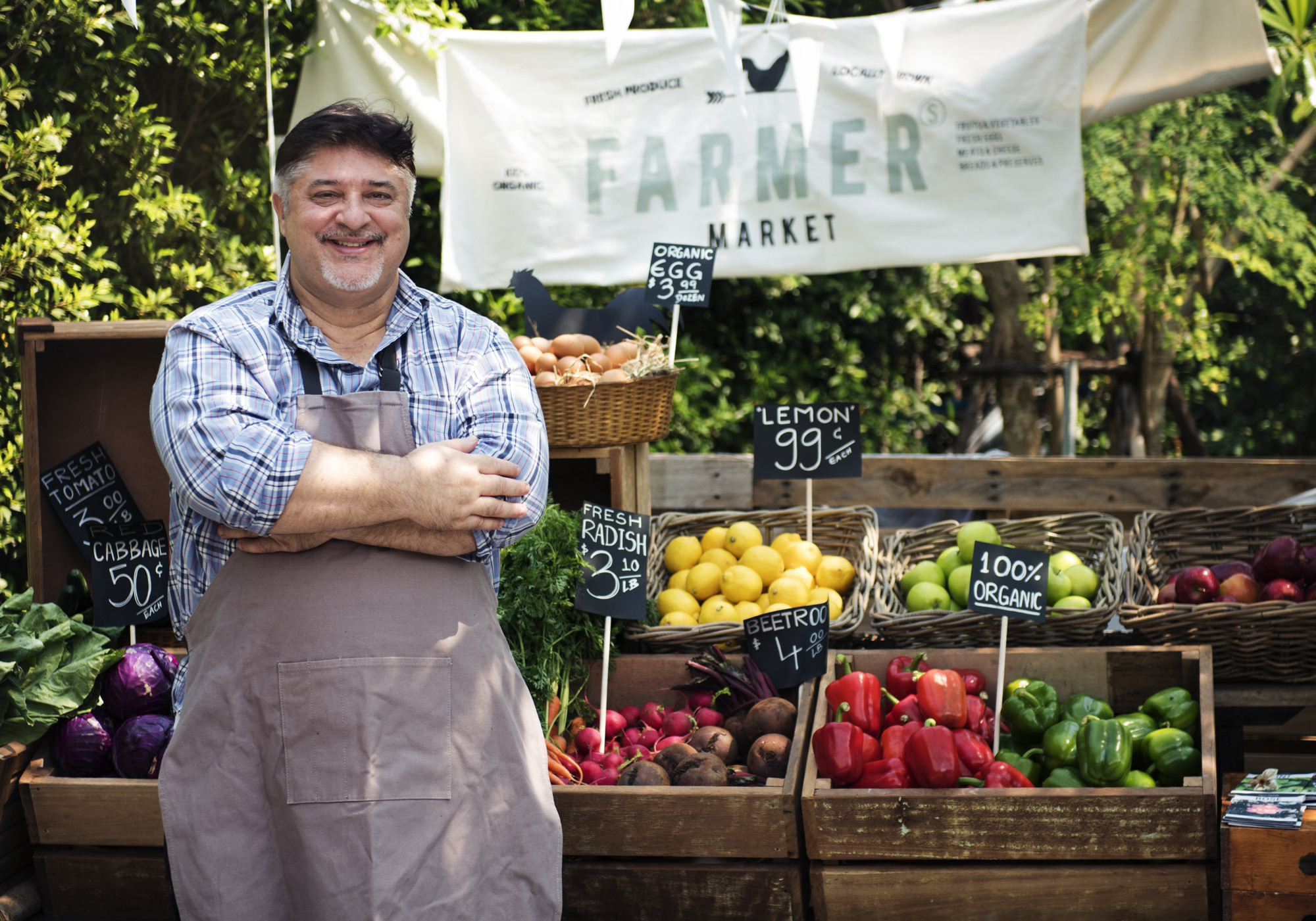 founder with local produce at market