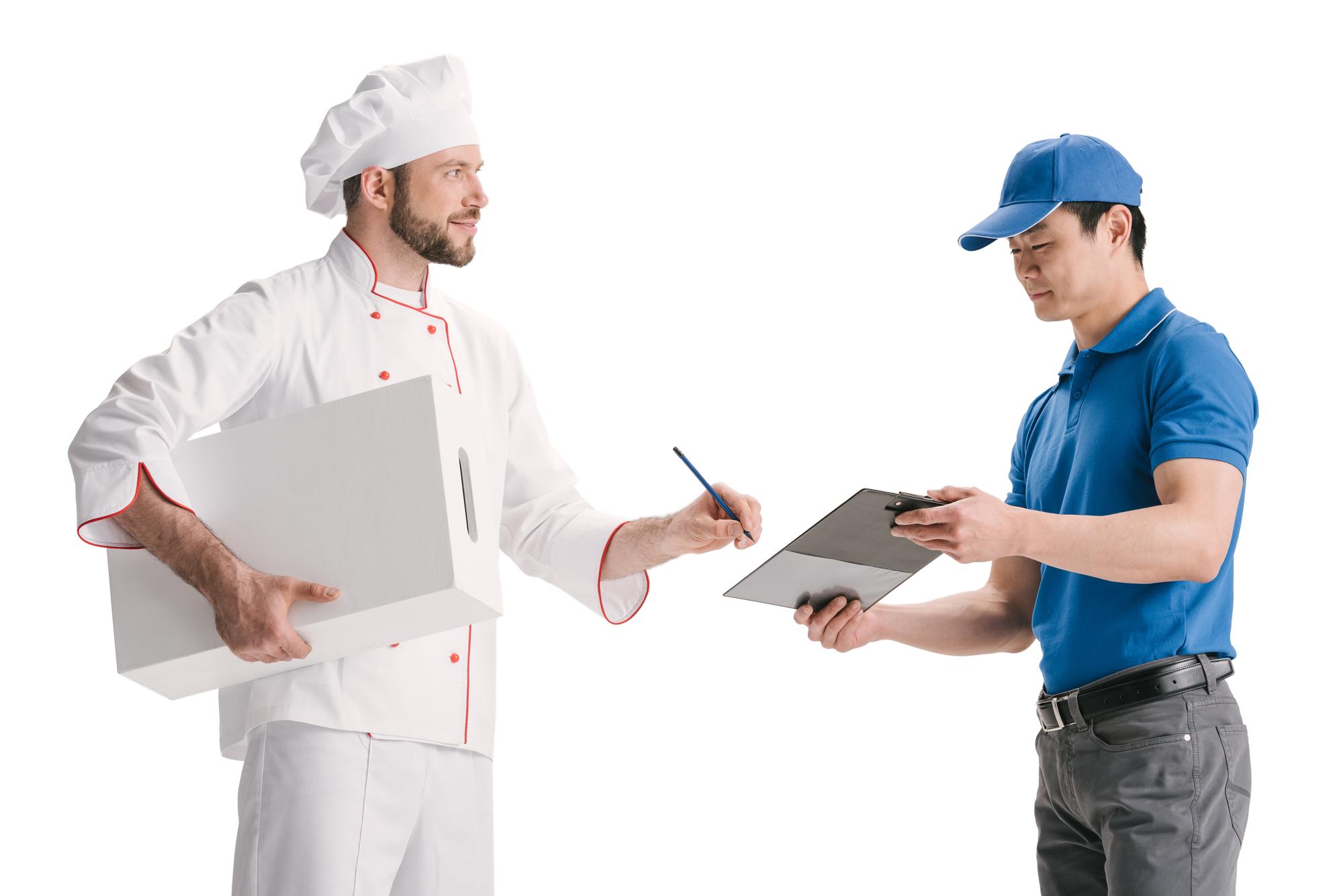 chef consulting with client at table